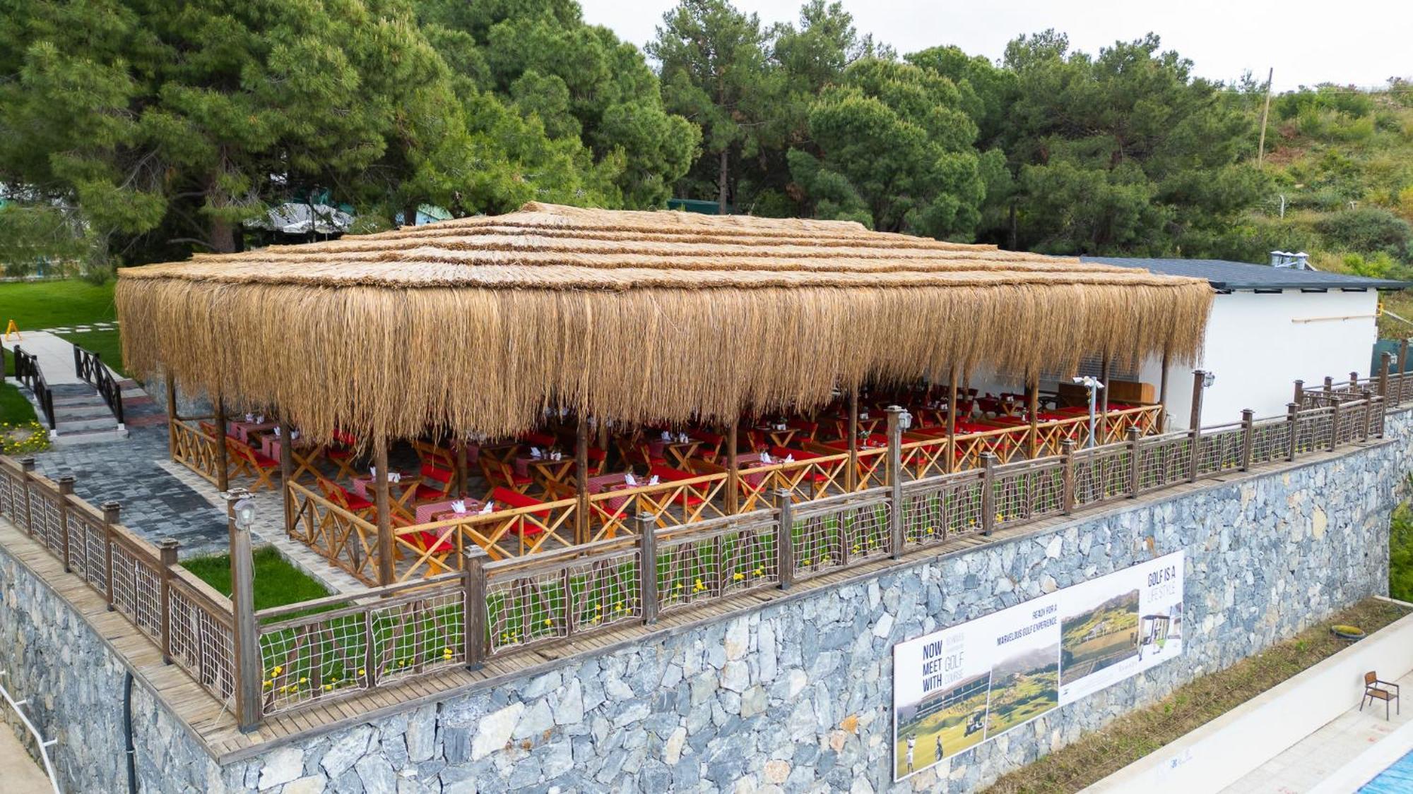 Ramada Resort Kusadasi & Golf Exterior foto Restaurant in the village
